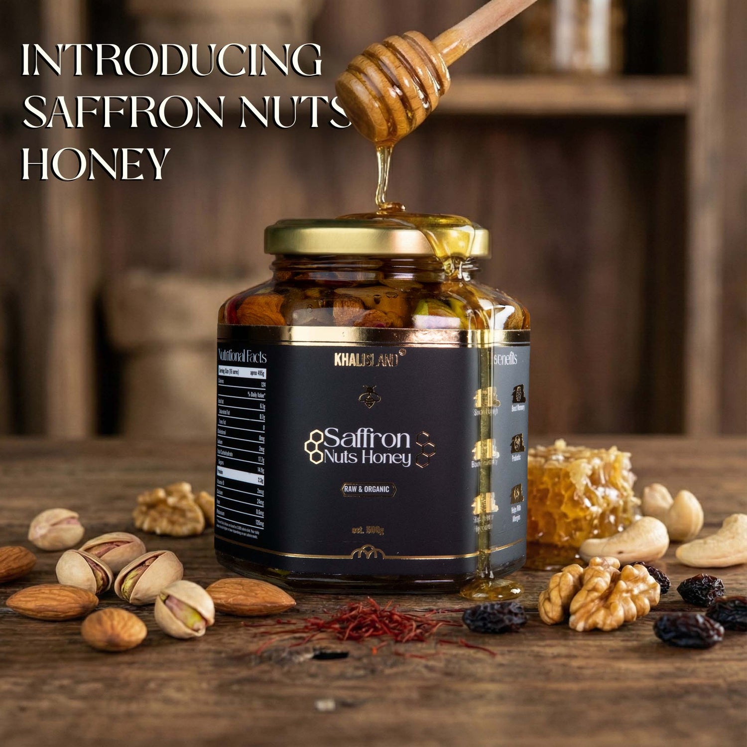 Jar of Saffron Nuts Honey with honey drizzled over it, surrounded by nuts and saffron on a wooden surface.