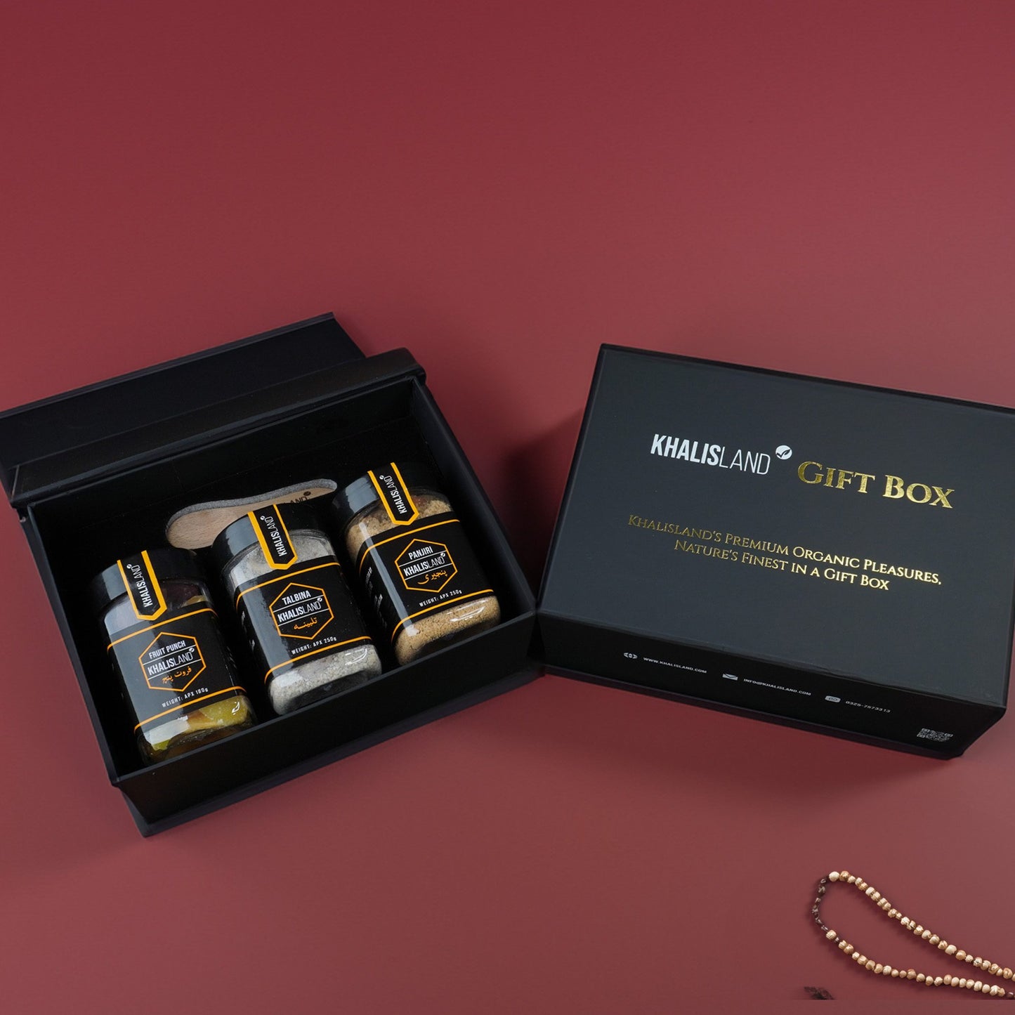 A gift box from Khalisland containing three food items: 'Panjeri', 'Fruit Punch', and 'Talbina', all displayed in a black box with the brand's logo.