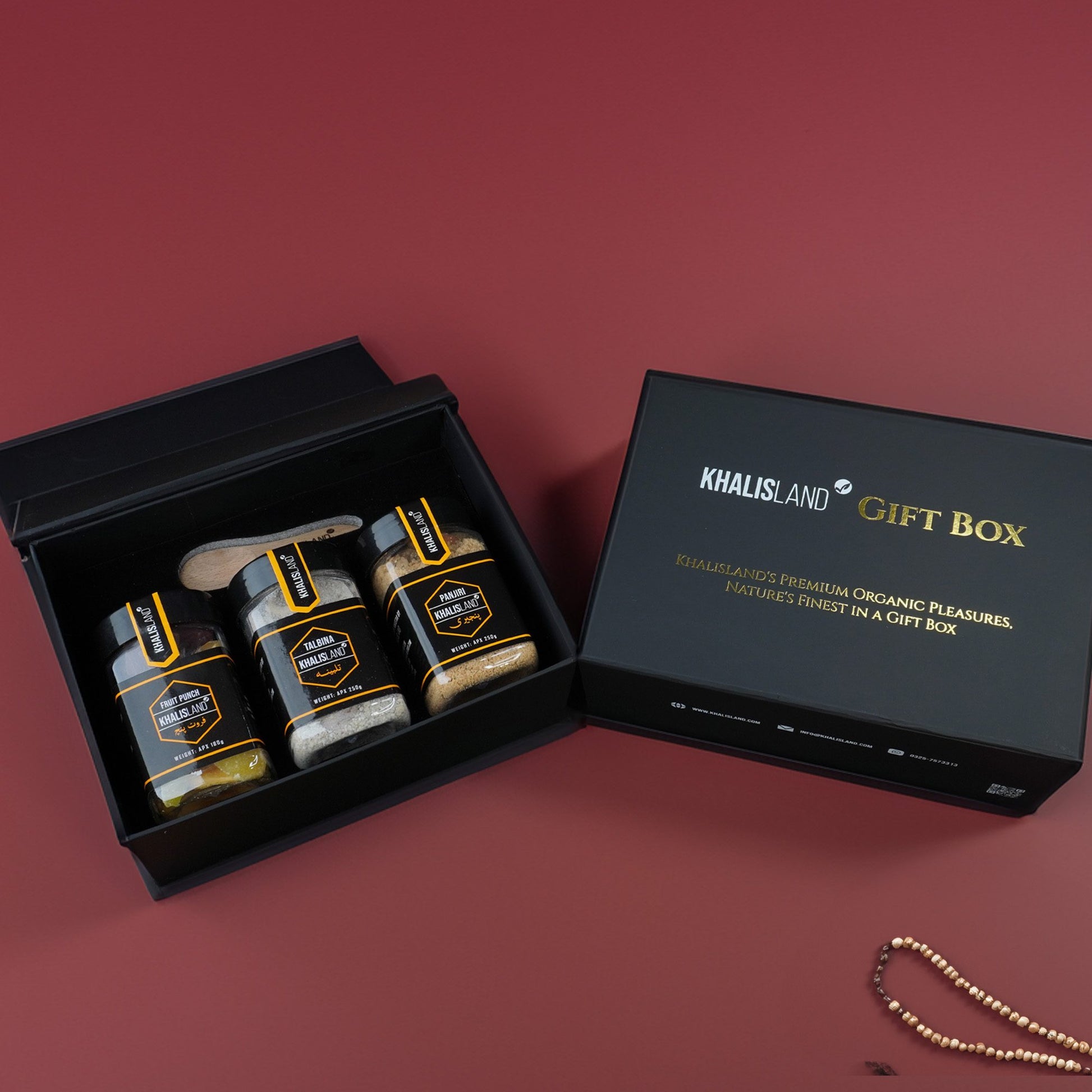 A gift box from Khalisland containing three food items: 'Panjeri', 'Fruit Punch', and 'Talbina', all displayed in a black box with the brand's logo.
