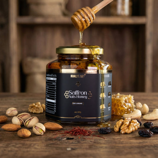 Jar of saffron nuts honey with a honey dipper and nuts on a wooden surface