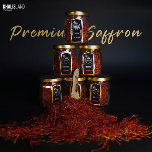 Multiple glass jars filled with saffron threads, arranged in a pyramid shape on a dark background, with the text 'Premium Saffron' displayed above.